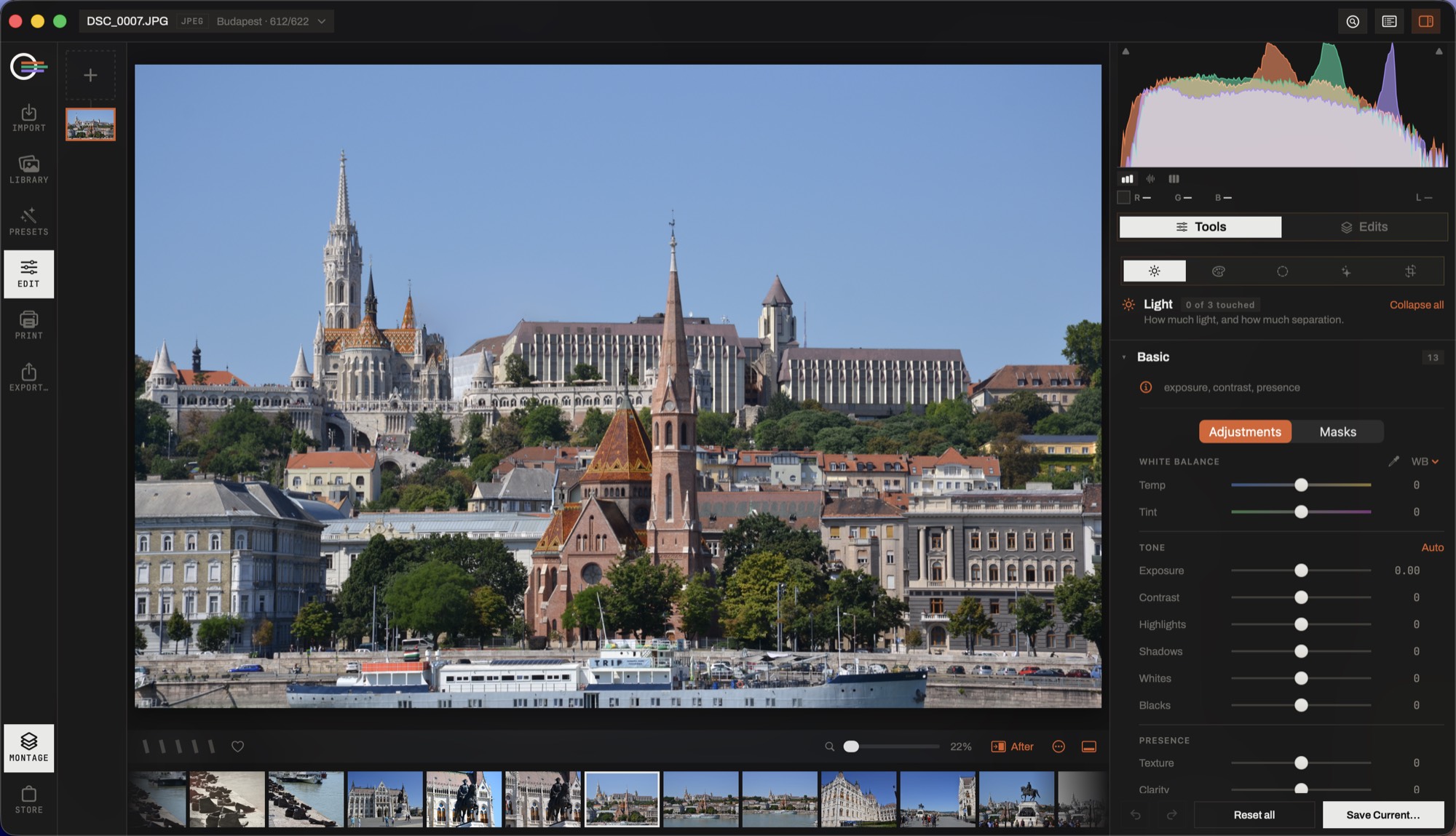 Lensmith's develop module: a photograph of Budapest on the canvas, the tool panel open on white balance and tone, the histogram pinned above it.